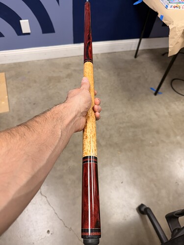 The birdseye maple and red epoxy cue