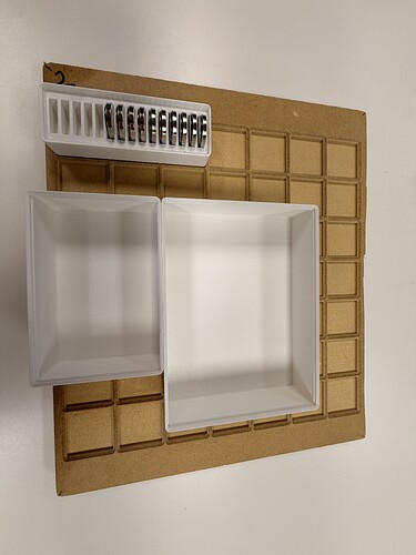 Bins and a magnet holder on the plate