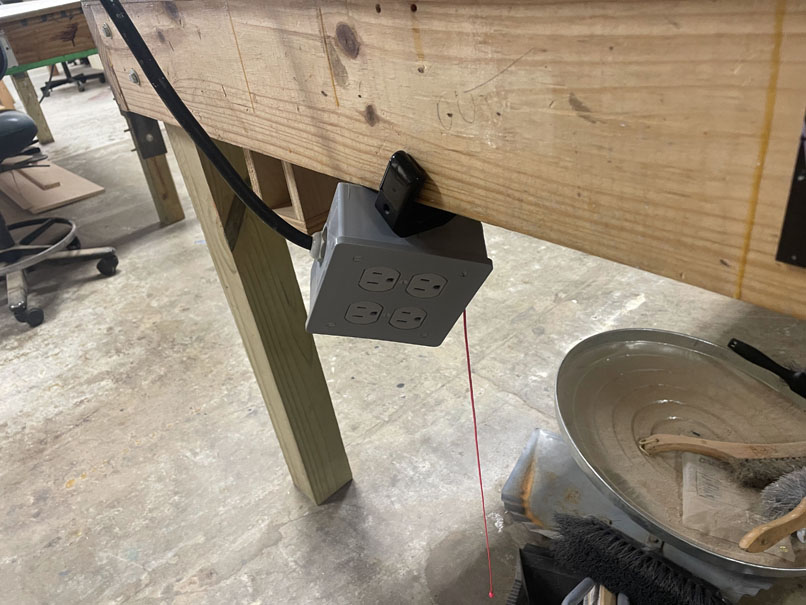Box Hooked Under Table